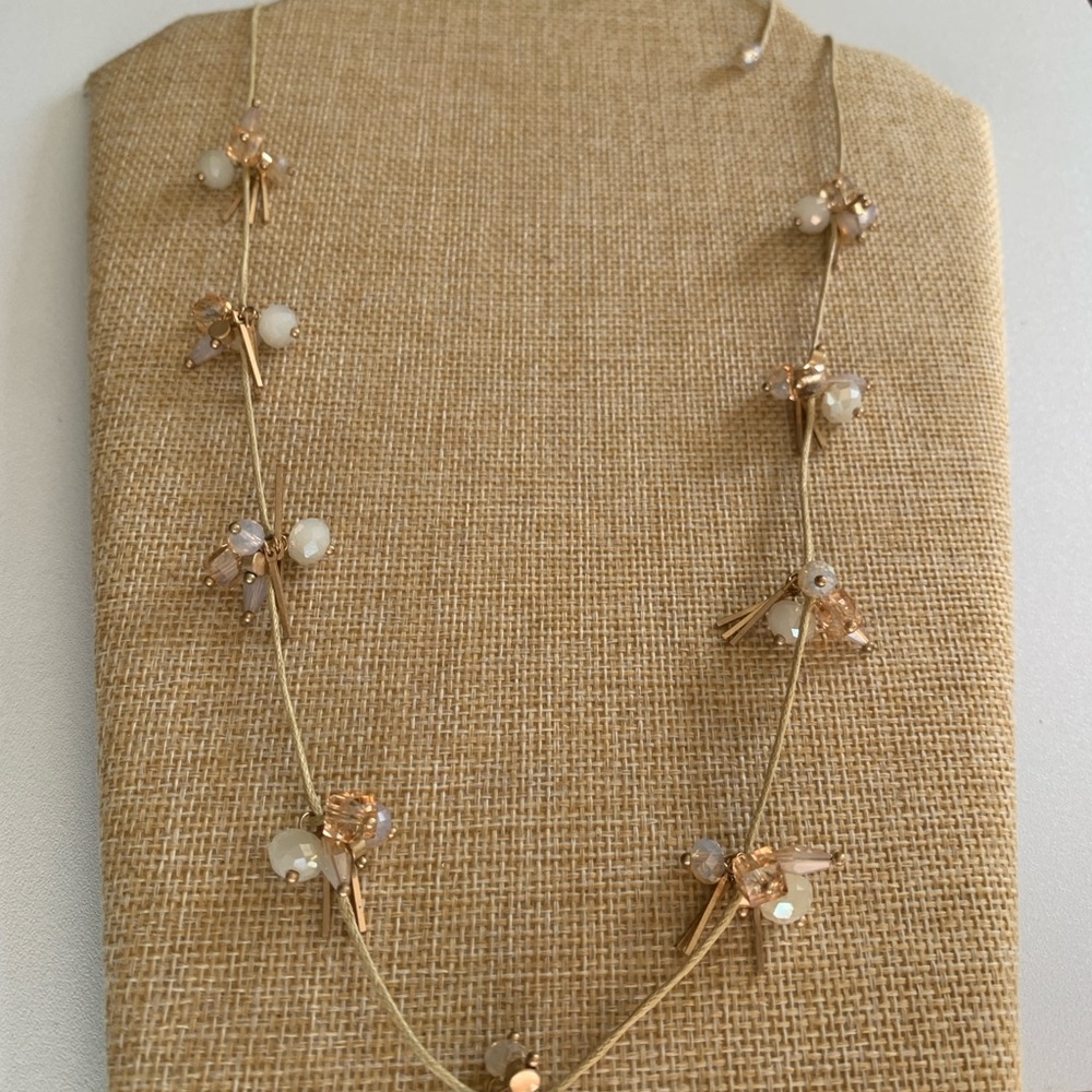 Elegant Gold Necklace with White and Beige Accents